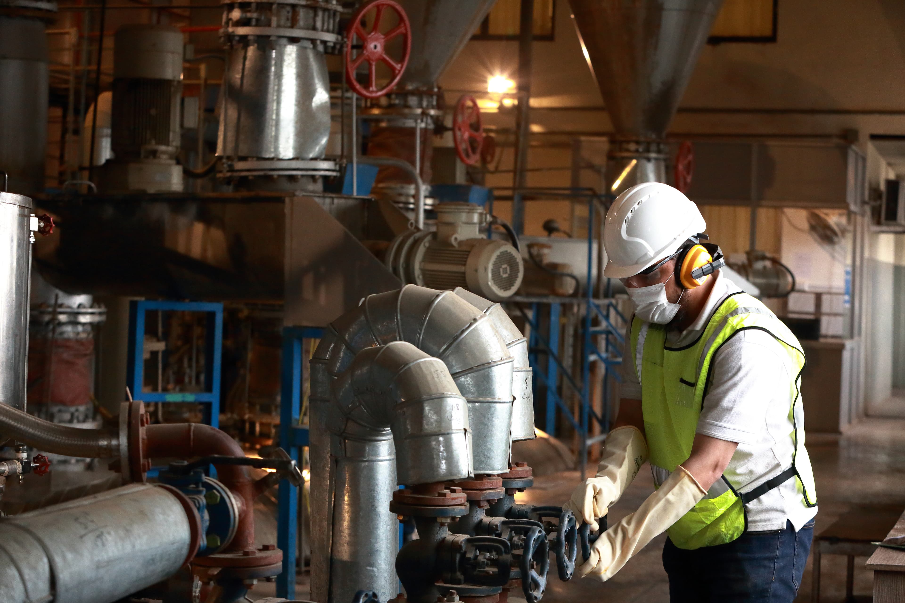 ZRK Group team reviewing site plans on the plant floor